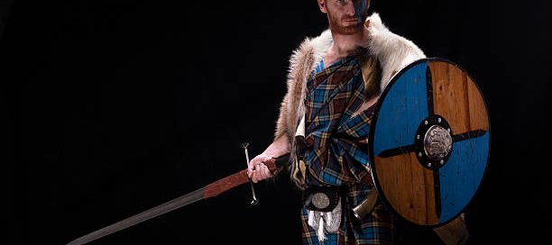 man holding a sword and shield